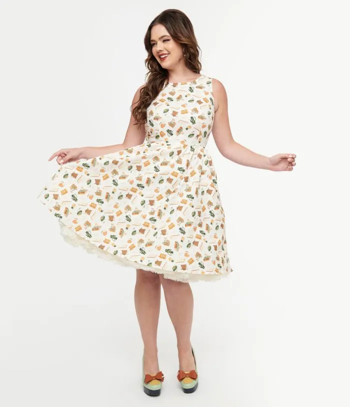 Retrolicious 1950s Cream Book and Tea Print Cotton Swing Dress Dresses Unique Vintage Pocket Dresses