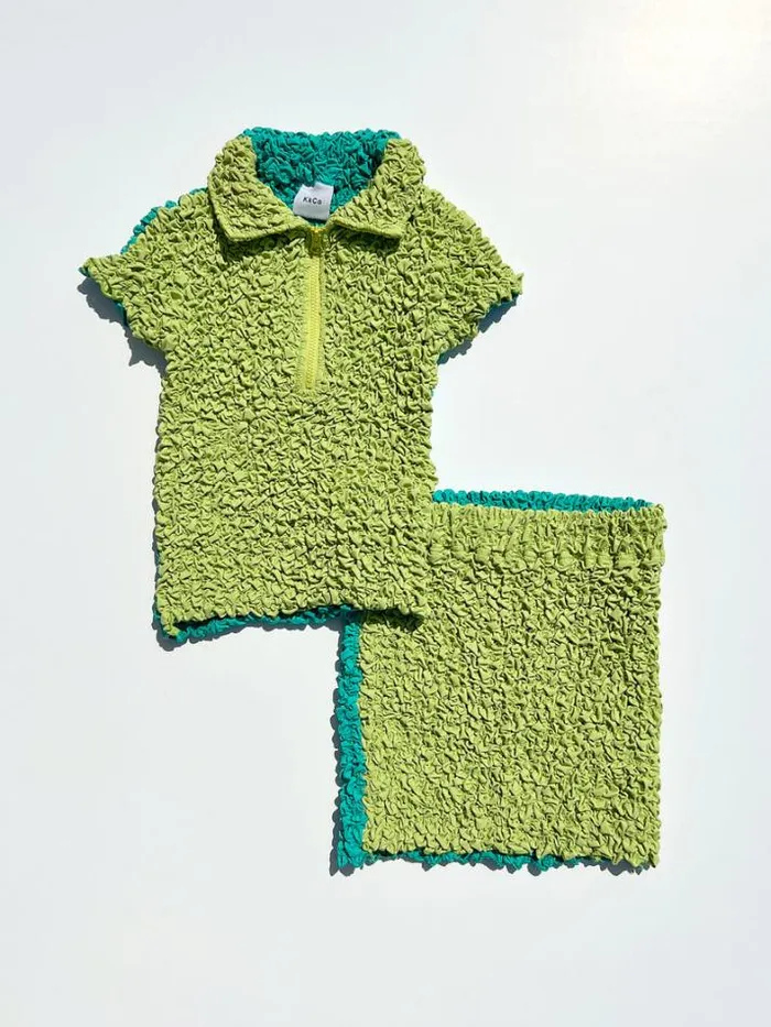 Tops Shop Lisa Says Gah Split Popcorn Polo